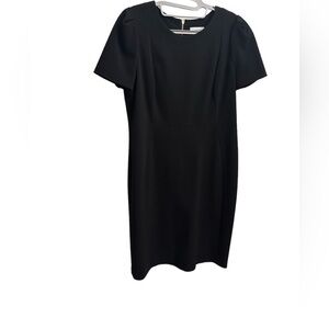 Calvin Klein black dress. Size 14. Gold Zipper. Puffed sleeves